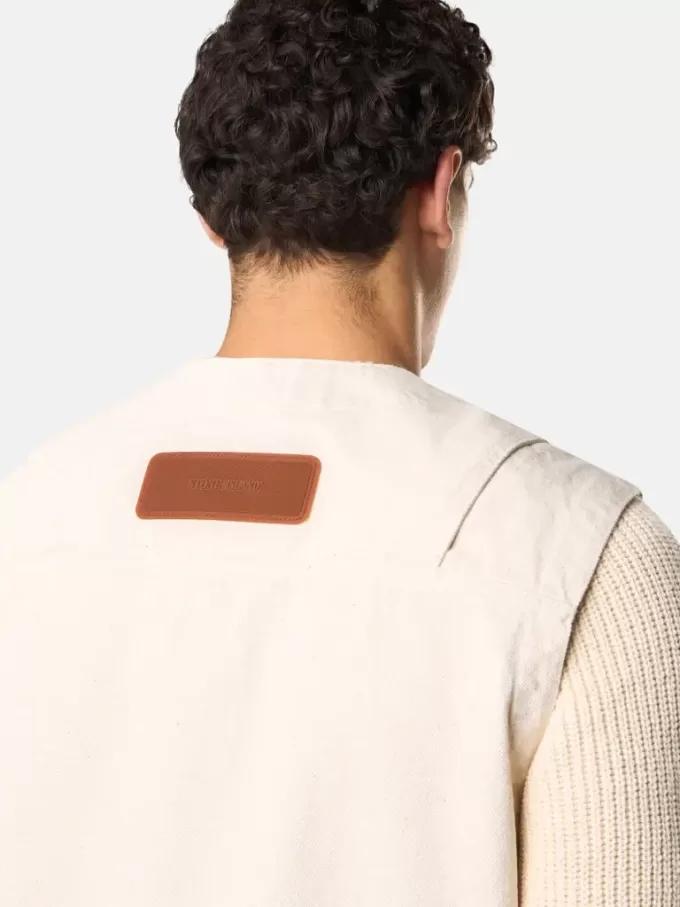 Gilet avec fermeture à boutons et empiècements en caoutchouc Gilet avec fermeture à boutons et empiècements en caoutchouc