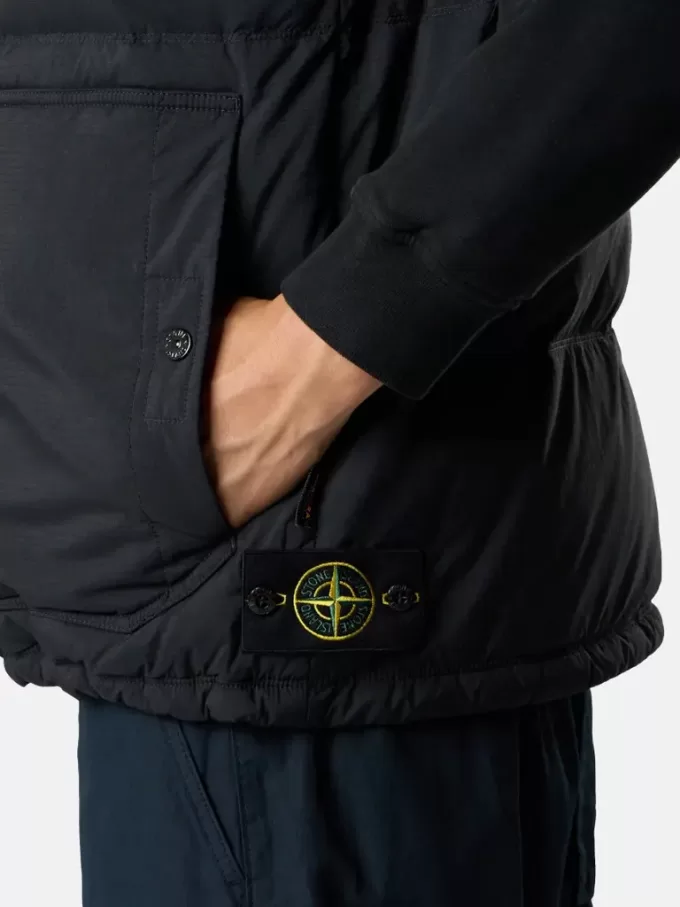 Gilet avec finition déperlante et poches à boutons-pression Gilet avec finition déperlante et poches à boutons-pression