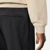 Pantalon de survêtement ample avec poches à boutons-pression et zippées Pantalon de survêtement ample avec poches à boutons-pression et zippées