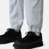 Pantalon de survêtement ample avec poches à boutons-pression et zippées Pantalon de survêtement ample avec poches à boutons-pression et zippées