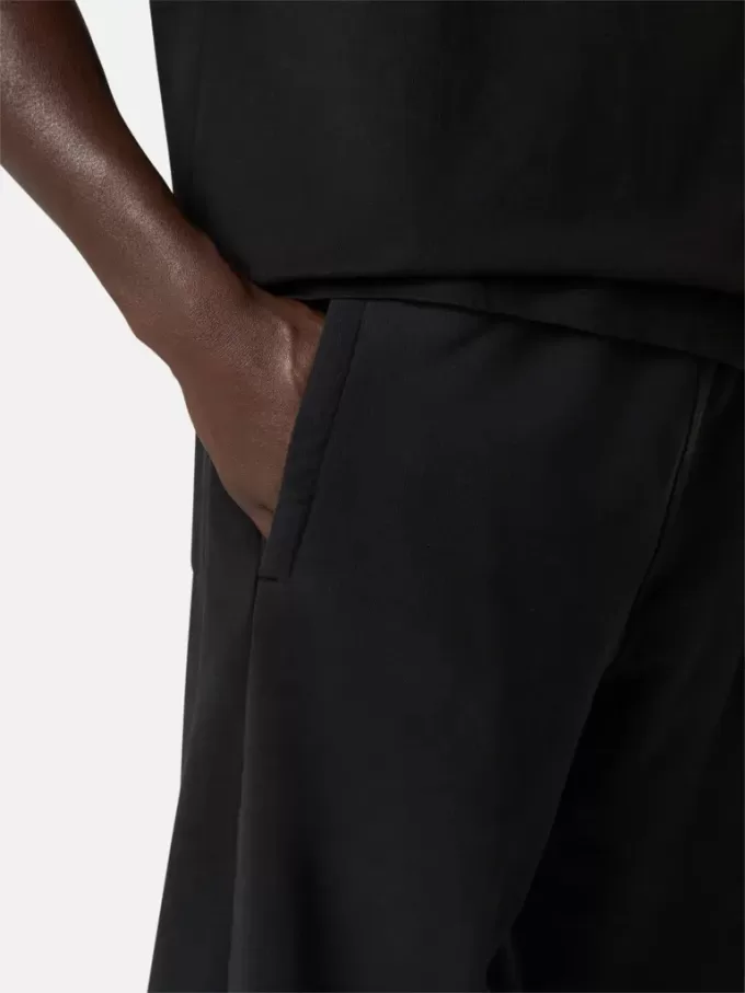 Pantalon de survêtement ample avec poches et poignets élastiqués Pantalon de survêtement ample avec poches et poignets élastiqués