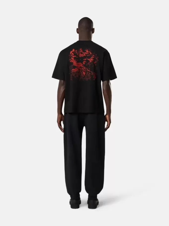 Pantalon de survêtement ample avec poches et poignets élastiqués Pantalon de survêtement ample avec poches et poignets élastiqués