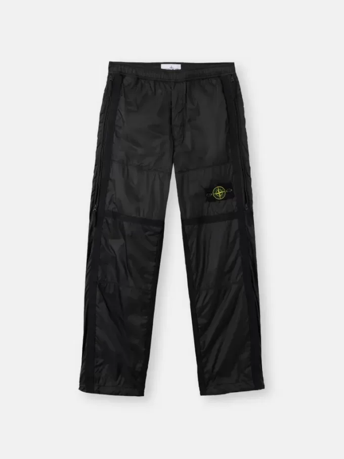 Pantalon de survêtement ample avec poches zippées et chevilles ajustables Pantalon de survêtement ample avec poches zippées et chevilles ajustables