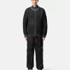 Pantalon de survêtement ample avec poches zippées et chevilles ajustables Pantalon de survêtement ample avec poches zippées et chevilles ajustables