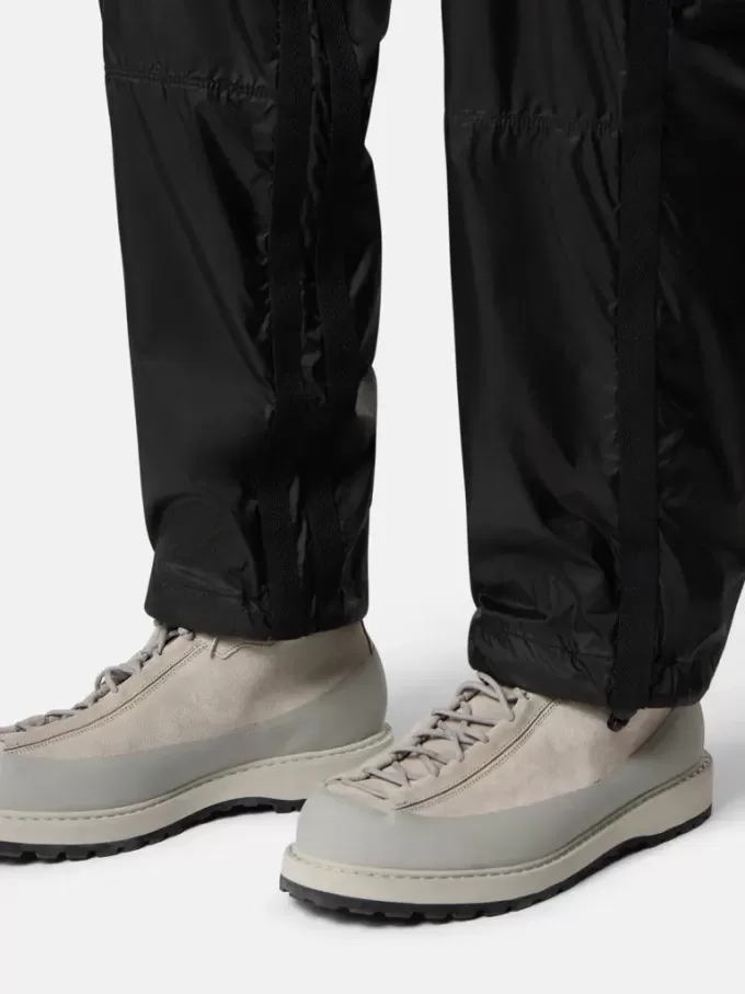 Pantalon de survêtement ample avec poches zippées et chevilles ajustables Pantalon de survêtement ample avec poches zippées et chevilles ajustables