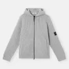 Pull à capuche zippé avec poches et côtes de pêcheur.