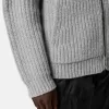 Pull à capuche zippé avec poches et côtes de pêcheur.