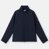 Veste coupe-vent et imperméable avec capuche dissimulée Veste coupe-vent et imperméable avec capuche dissimulée
